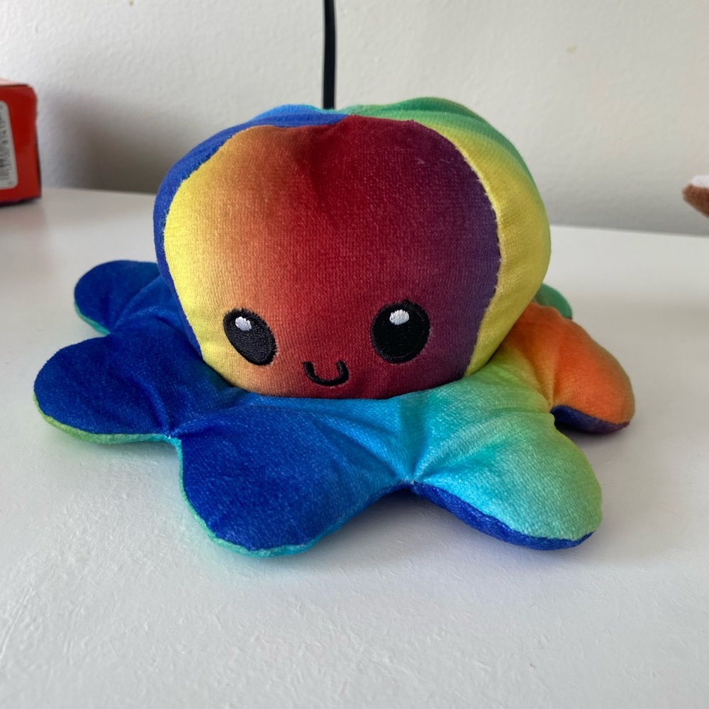 Smile/frown reversible little octopus plush